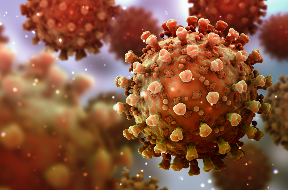 A digital graphic depicting a cluster of orange COVID-19 virus particles.
